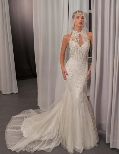 Shimmering halter neck mermaid wedding dress with beaded lace and basque waist by Papilio Boutique bridal store in Toronto.