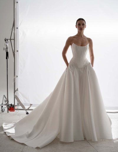 Front view of Papilio Mikado two piece wedding dress in Toronto showing structured corset and voluminous dropped-waist skirt without bolero.