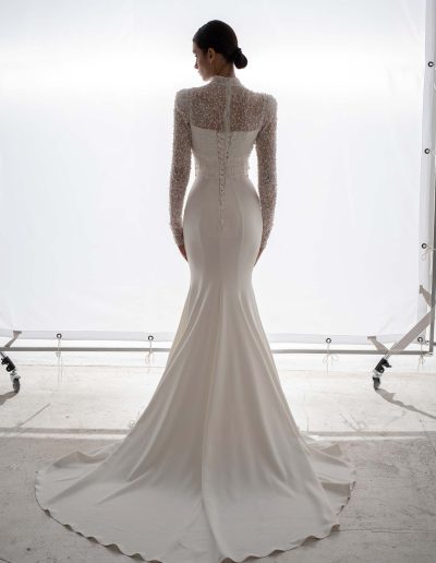 Back view of wedding dress with long sleeve beaded blouse and lace-up detail by Papilio Boutique, bridal shop Toronto.