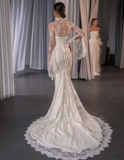 Lace bridal separates with bell sleeves and corset bodice by Papilio Boutique, photographed at a Toronto bridal shop.