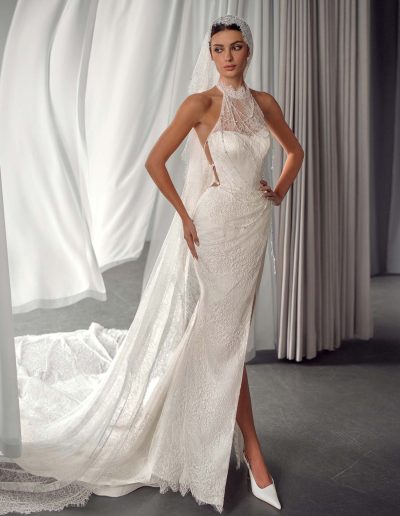 Lace halter neck wedding dress with open back and slit, by Papilio Boutique bridal store in Toronto.