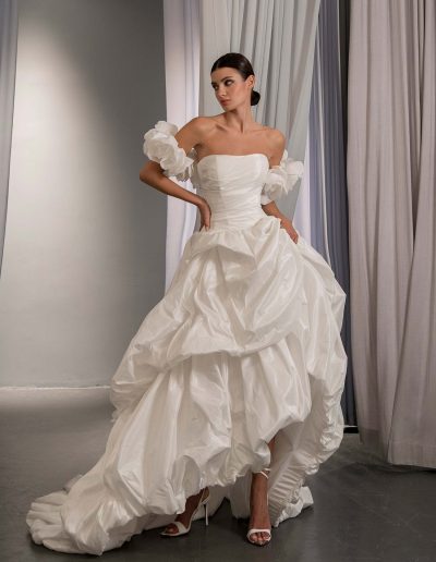 High low wedding dress with off the shoulder 3D floral sleeves and layered bubble skirt, by Papilio Boutique, Toronto bridal store.