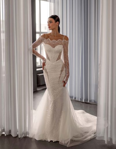 Sequin off the shoulder wedding dress with long sleeves by Papilio Boutique, designed with a basque waist and couture detailing, from a Toronto bridal store.