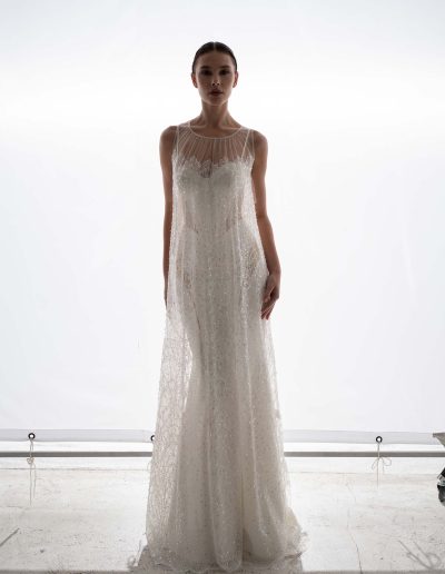 Cut out fit and flare wedding dress with sheer overlay dress by Papilio Boutique, Toronto bridal store.