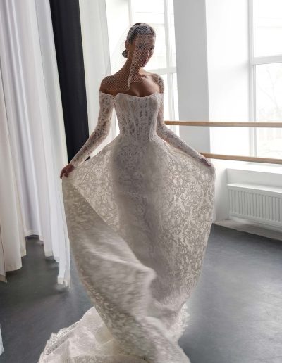 Classic lace A-line wedding dress with semi sheer corset and off the shoulder sleeves, offered at Papilio Boutique bridal shop Toronto.