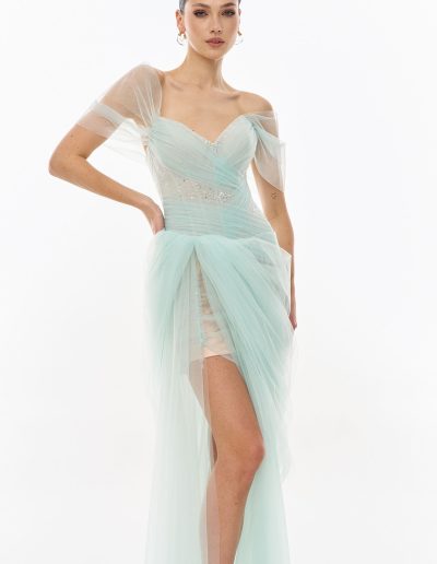 Off the shoulder tulle dress with asymmetrical skirt in soft mint tone by Papilio Boutique dress boutique in Toronto