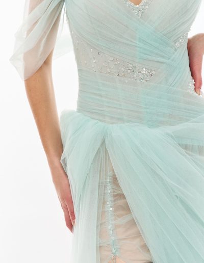 Close-up of draped tulle bodice on off the shoulder tulle dress with asymmetrical skirt by Papilio Boutique