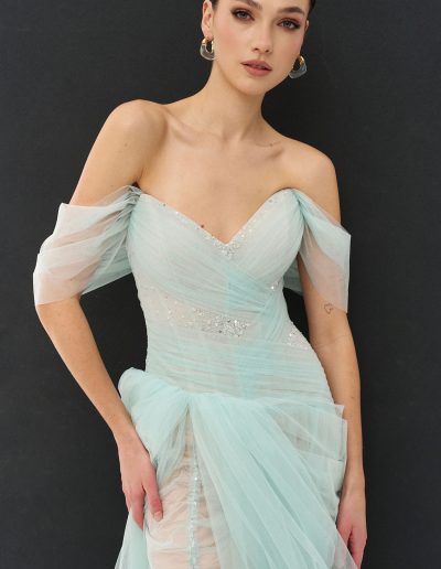 yered off the shoulder tulle dress with asymmetrical skirt offered at Papilio Boutique Toronto dress shop
