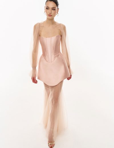 Strapless corset dress with basque waist styled with sheer tulle long sleeve bolero and flowing underskirt by Papilio Boutique