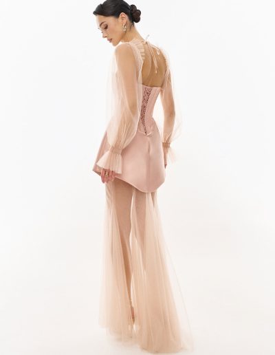 Strapless corset dress with lace-up back styled with sheer long sleeve bolero and flowing underskirt by Papilio Boutique