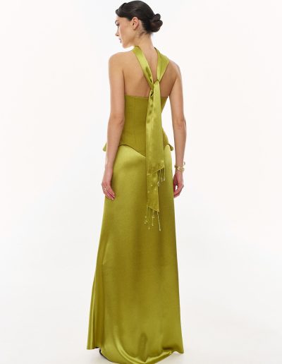 Back view of two piece corset evening dress featuring fitted corset and draped scarf detail, offered at Papilio Boutique.