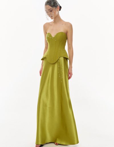 Full length front view of structured corset evening dress with fluid skirt and beaded detailing, offered at Papilio Boutique.