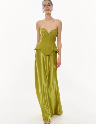 Full length front view of structured corset evening dress with fluid skirt and beaded detailing, offered at Papilio Boutique.