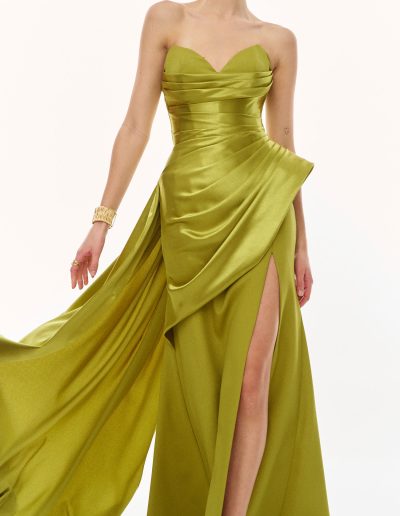 Close-up of strapless evening gown bodice with internal structure and soft draped detailing, offered at Papilio Boutique.