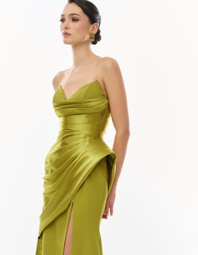 Side detail of strapless draped evening gown highlighting sculptural hip structure, offered at Papilio Boutique