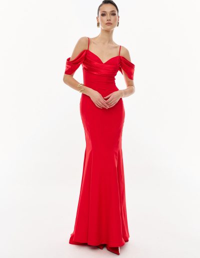 Red off the shoulder fit and flare evening gown in crepe satin, offered at Papilio Boutique.