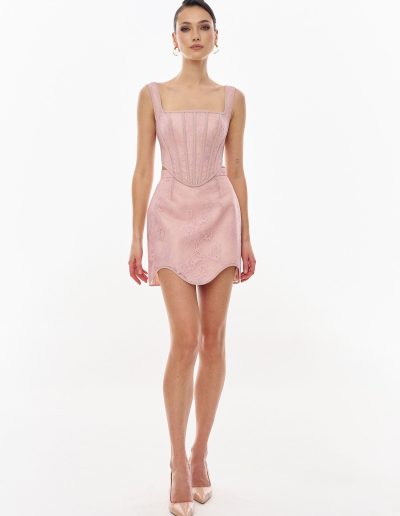 Front view of blush two piece lace corset mini dress set with square neckline and structured boning offered at Papilio Boutique Toronto.