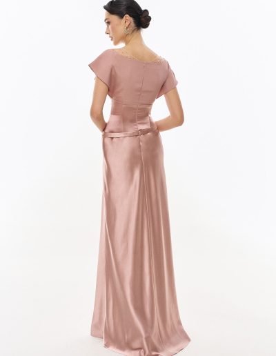 Back view of cap sleeve formal evening gown with smooth flowing skirt offered at Papilio Boutique.