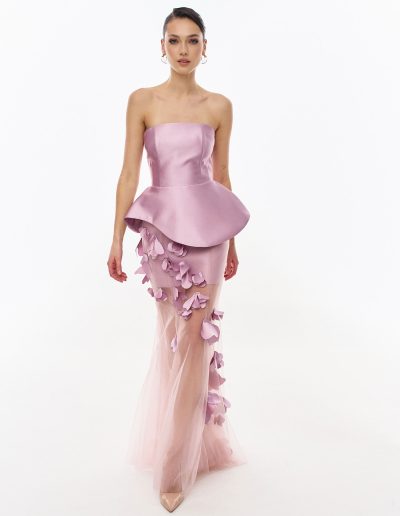 Front view of peplum corset evening dress with tulle overskirt and 3D floral appliqués offered at Papilio Boutique.