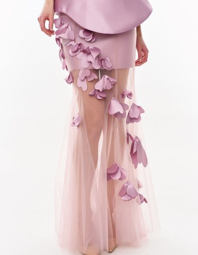 Close-up detail of 3D mikado floral appliqués on tulle overskirt offered at Papilio Boutique.