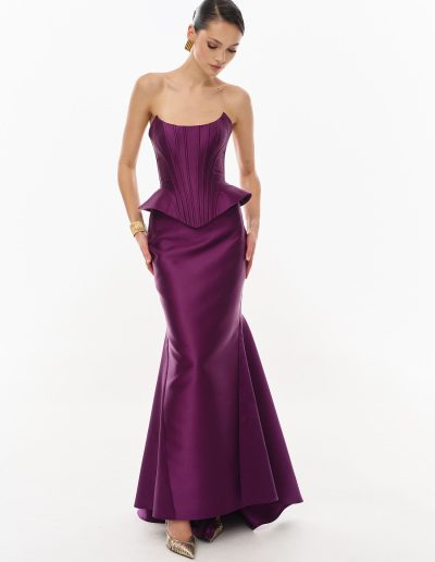 plum peplum corset dress offered at Papilio Boutique.