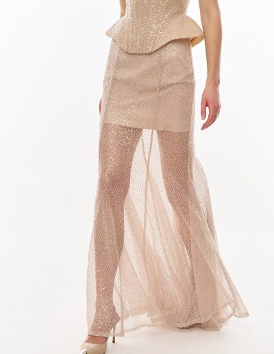 Close-up of sequined tulle skirt overlay with fitted underlayer offered at Papilio Boutique.