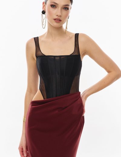 Close-up of structured corset bodice with illusion mesh offered at Papilio Boutique.