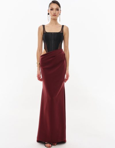 Modern corset dress with draped silk skirt offered at Papilio Boutique.