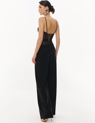 Back view of black corset top with lace-up detail and wide-leg pants offered at Papilio Boutique evening dresses store in Toronto.