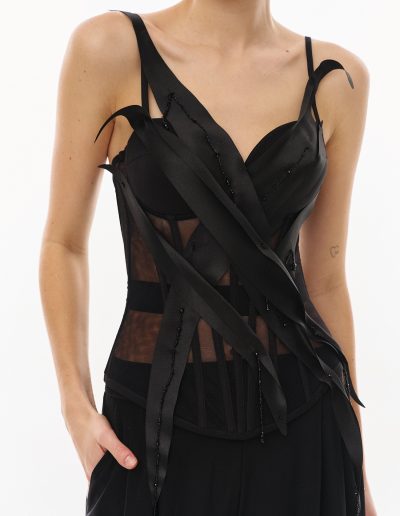 Black corset top with wide-leg pants set offered at Papilio Boutique evening dresses store in Toronto.
