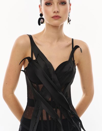 Close-up of black sheer corset top offered at Papilio Boutique evening dresses store in Toronto.