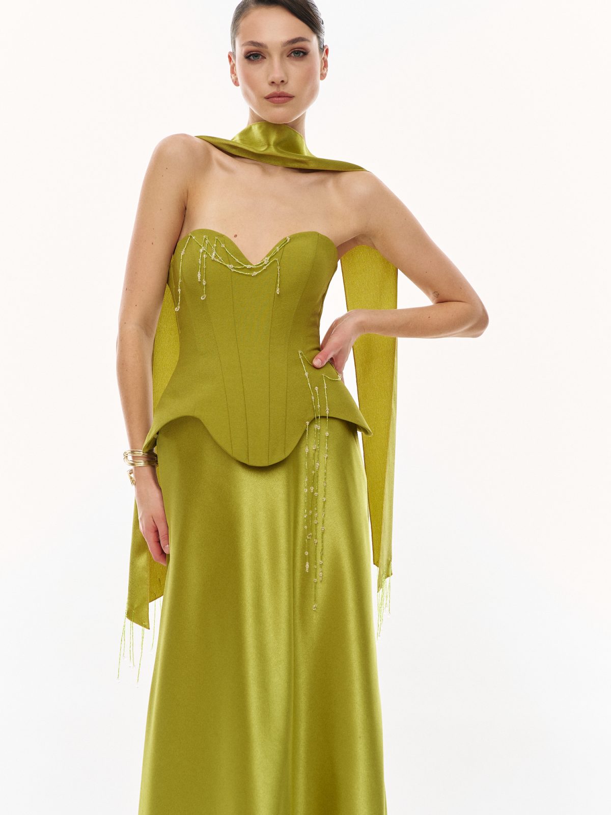 Olive green strapless corset gown with draped neck scarf and delicate beading, elegant option for wedding guest dresses by Papilio Boutique Toronto