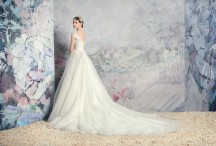 Style #1631L, tulle ball gown wedding dress with pleated bodice and lace accents, available in cream